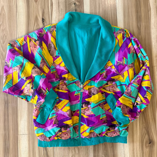 Colorful jacket with a pattern on a wooden surface